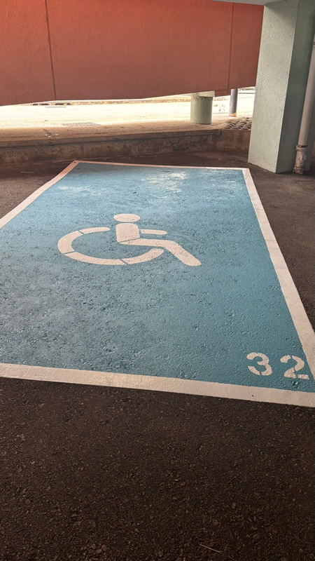 Accessible parking bay marked with a wheelchair symbol